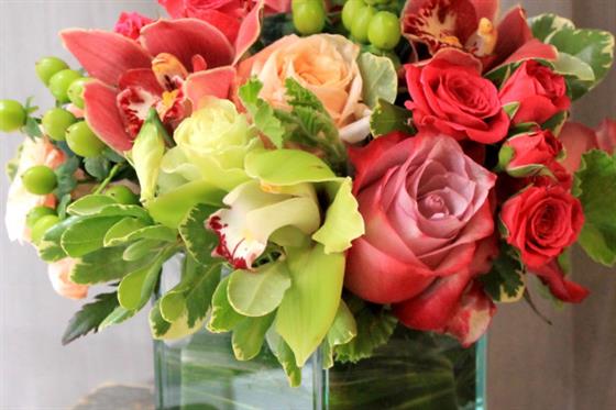 Table Arrangement with Green and Orange Cymbidium Orchids
